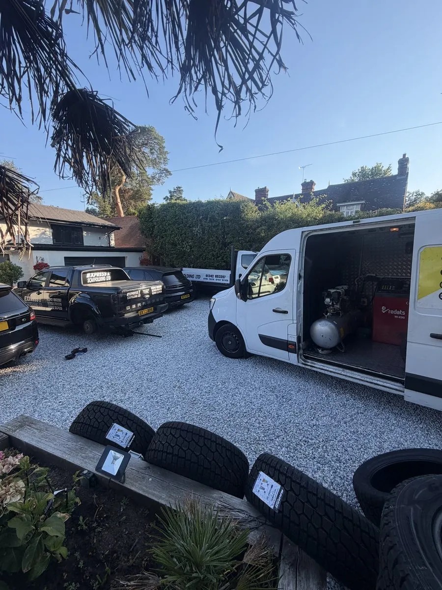Open mobile tyre fitting van showing the compressor and fitting equipment on board